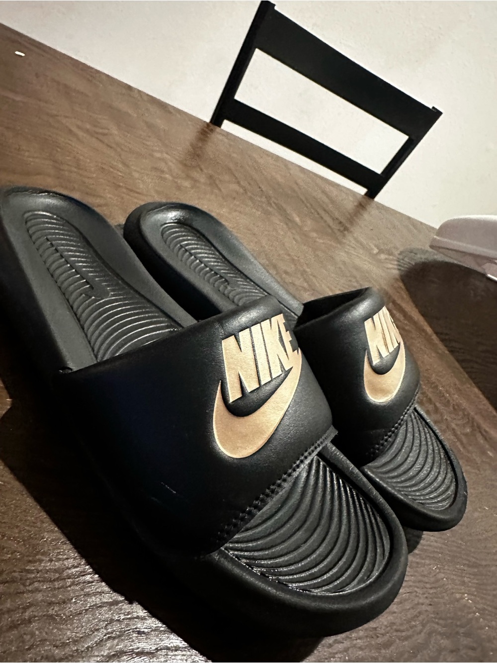 Nike Black Slides with Metallic Gold Swoosh